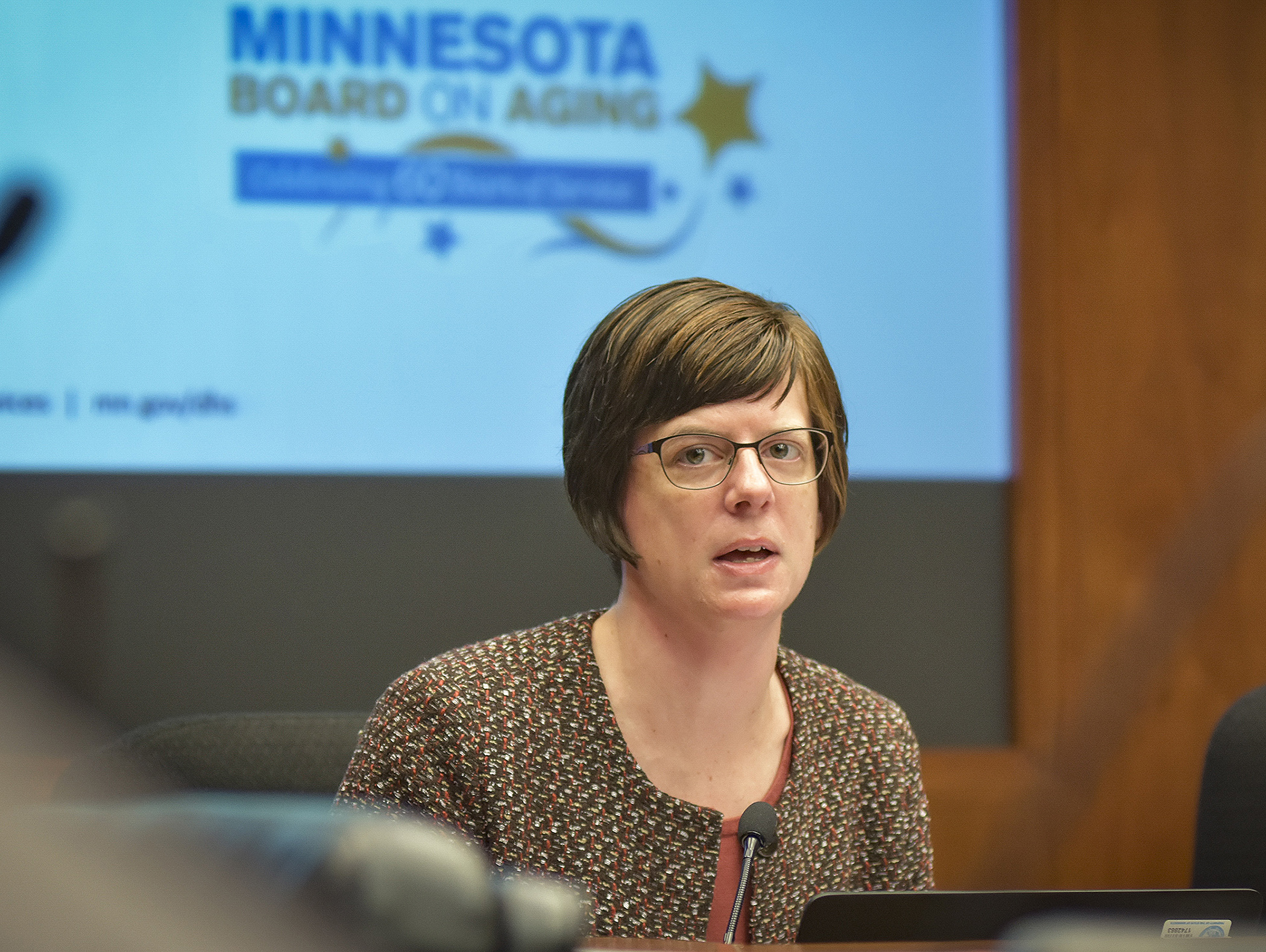 Kari Benson, director of the Human Services Department’s Aging and Adult Services Division, testifies Jan. 25 before the House Subcommittee on Aging and Long-Term Care during a presentation on Area Agencies on Aging and the Board on Aging. Photo by Andrew VonBank